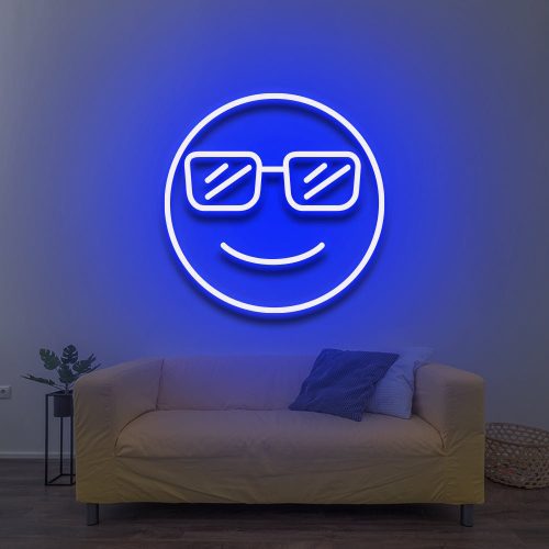 Cool LED Neon Sign featuring a smiling face with sunglasses, glowing blue against a light wall, perfect for modern room decor above a couch.  