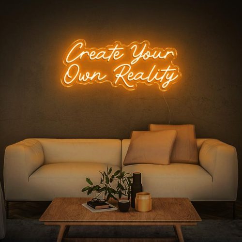 Create Your Own Reality neon sign in orange, displayed in a modern living room with a beige sofa and coffee table decor.